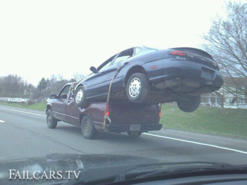 Car Strapped To Truck Fail